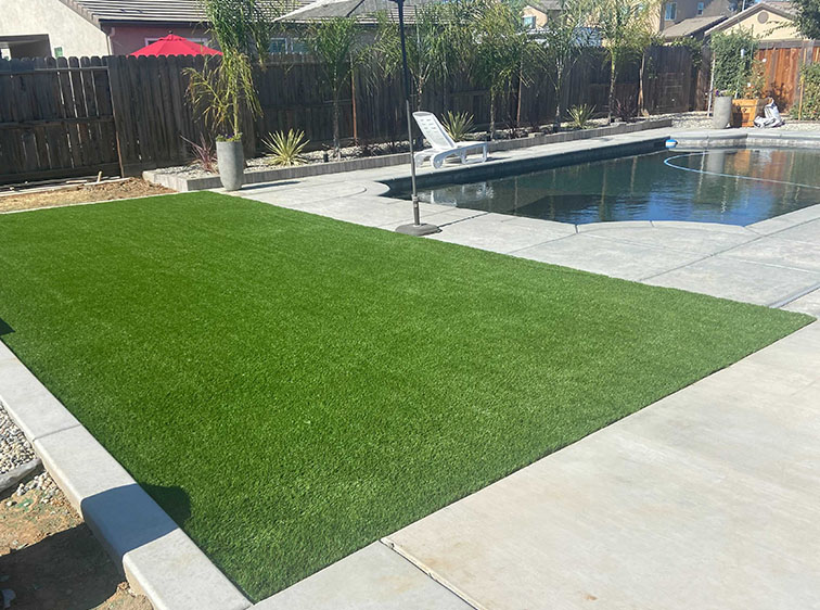 How Does an Artificial Grass Installation in Orlando Stands Up to Pool Chemicals?