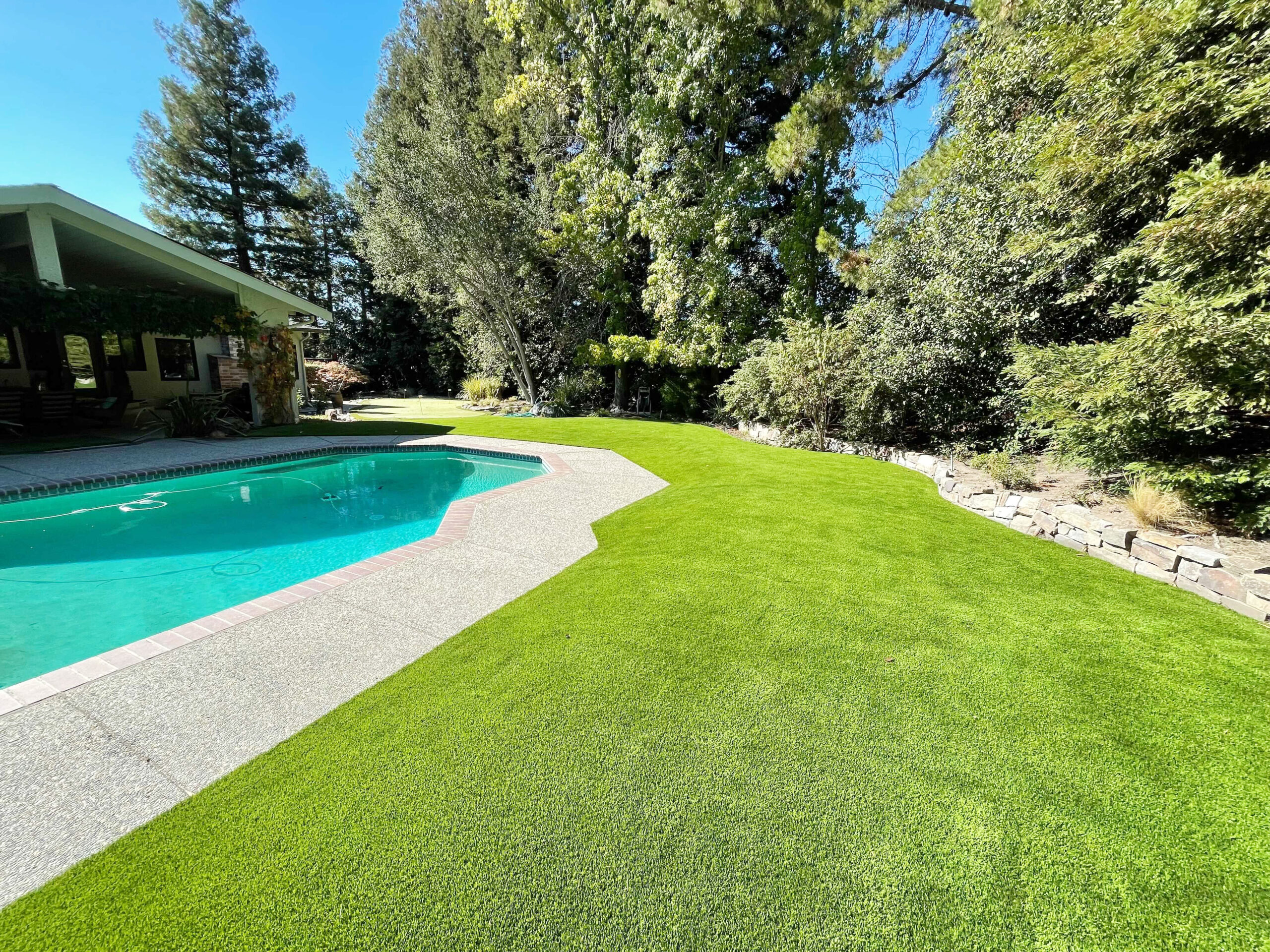 How to Create a Low-Maintenance Pool Area with Artificial Turf